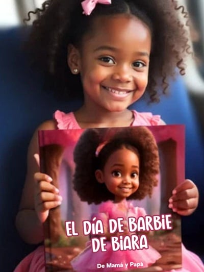 Child smiling while holding their personalized children's book from Mibook