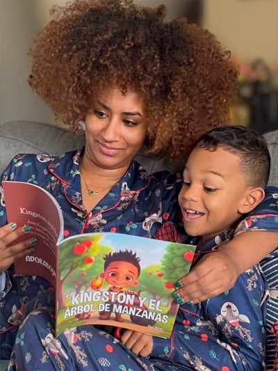 Kid proudly displaying their custom illustrated personalized children's book